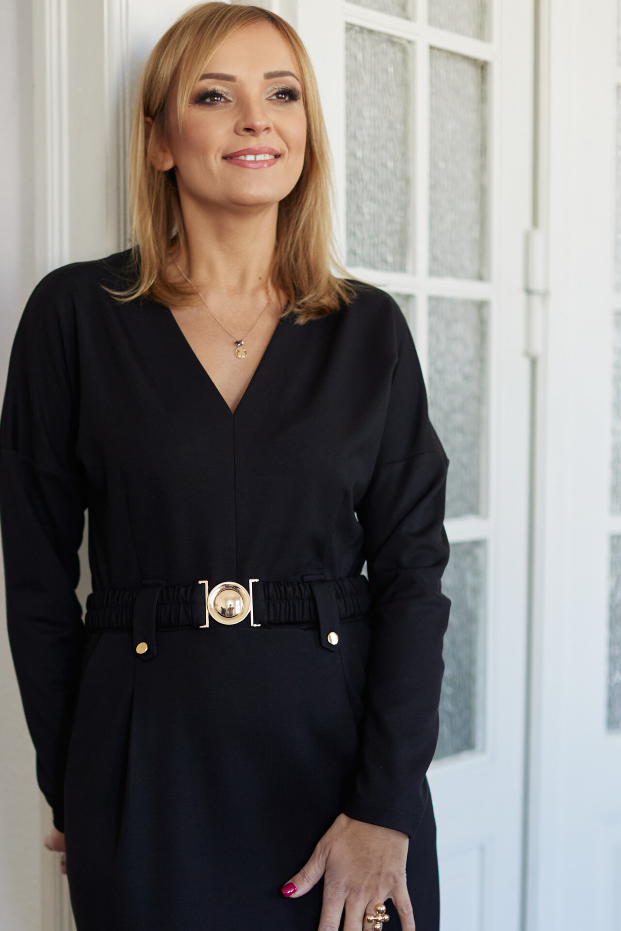 Elegant black dress with gold fittings