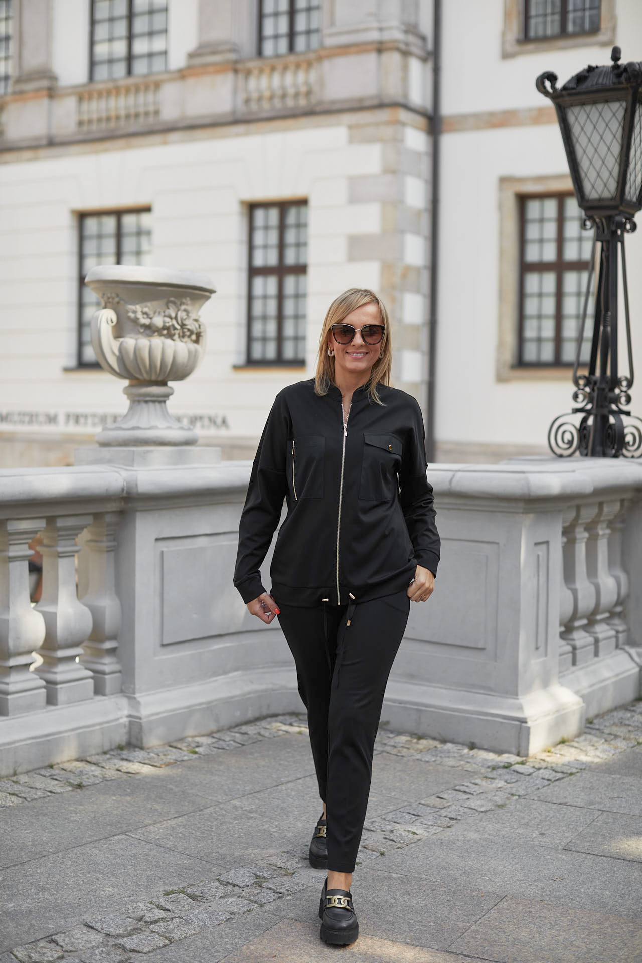 Zip-up black sweatshirt with metal fittings