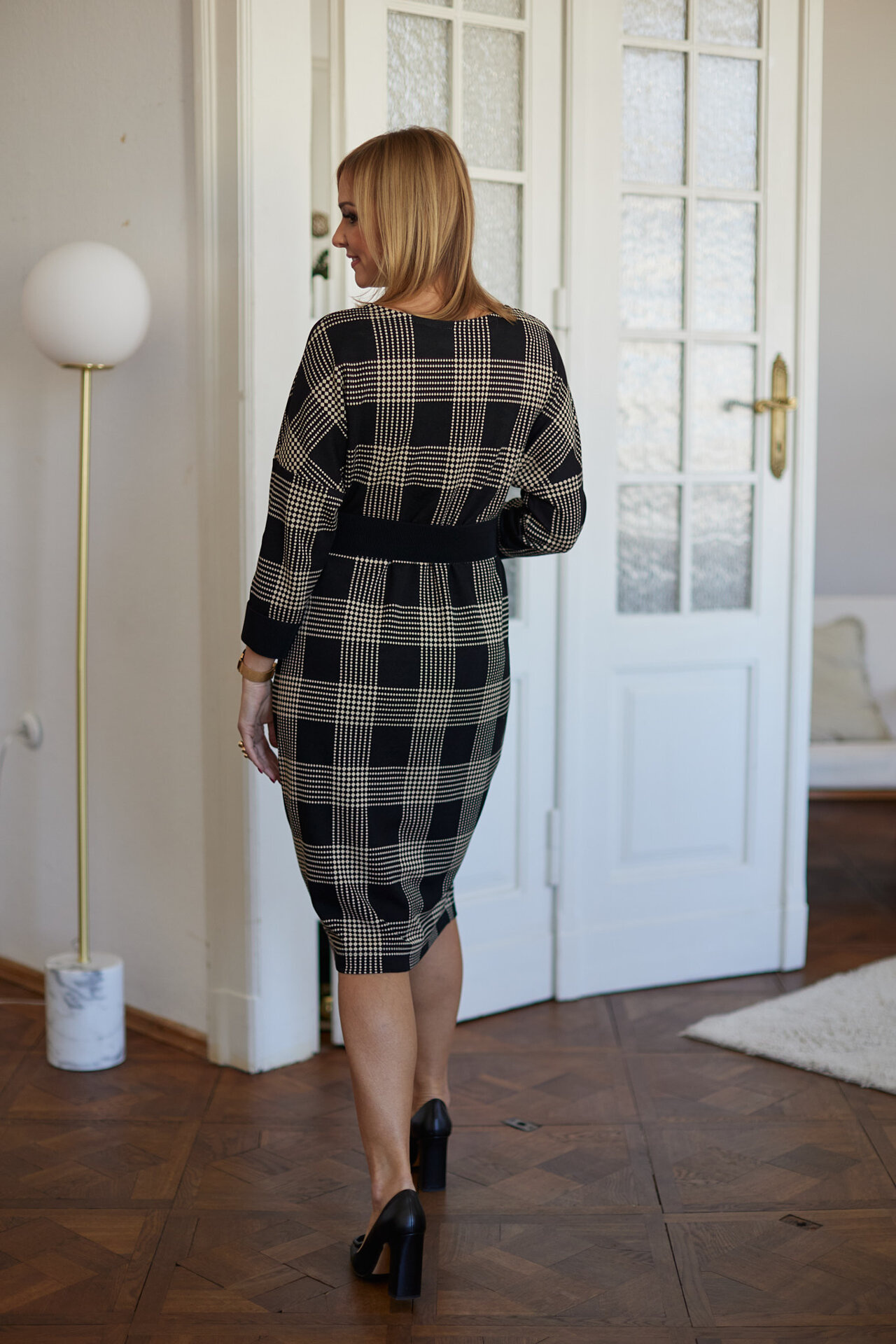Beige and black checkered dress below the knee with a belt included