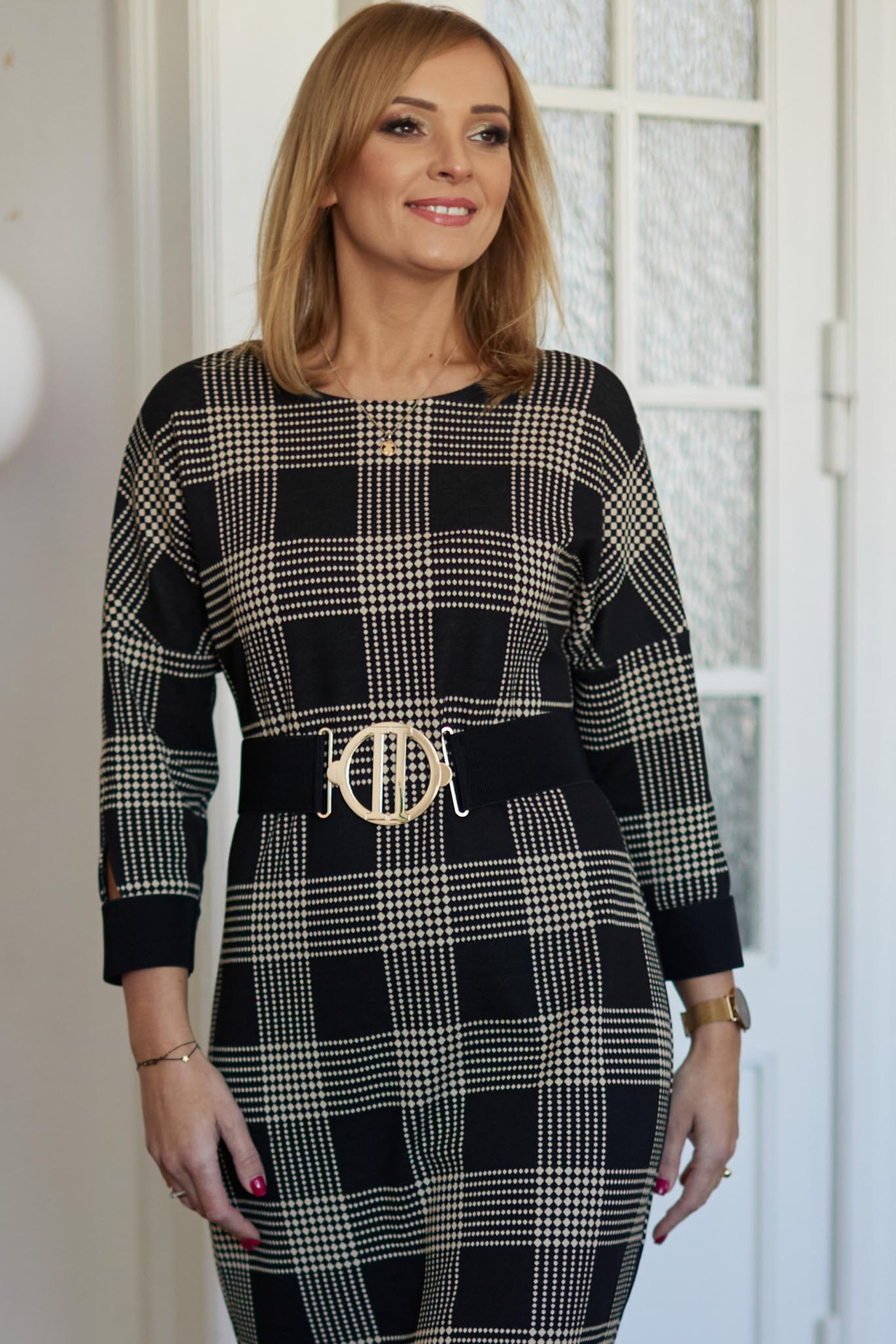 Beige and black checkered dress below the knee with a belt included