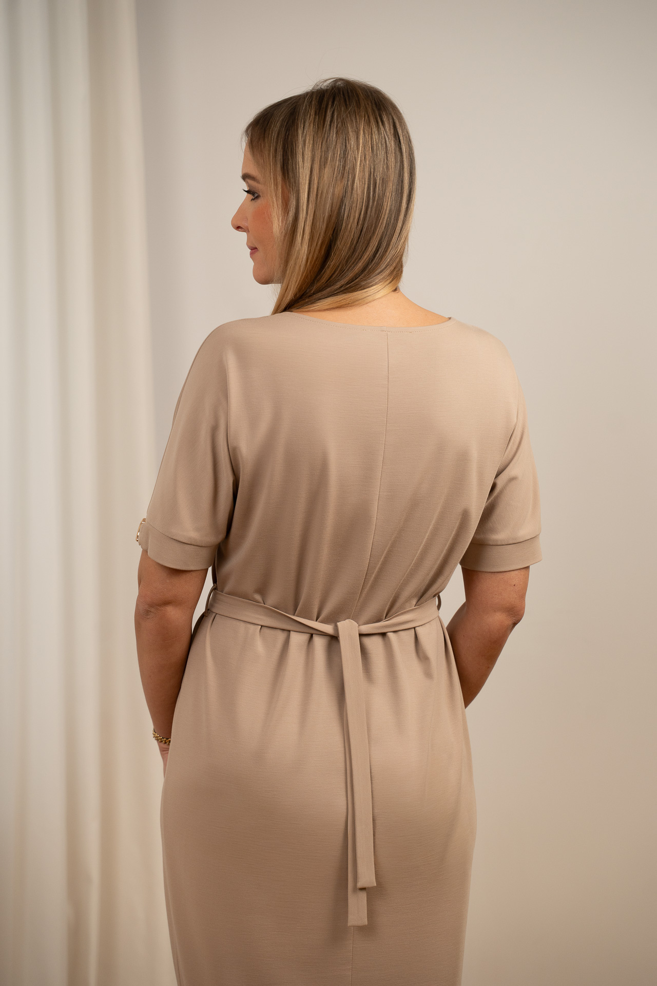 Knitted dress with metal emblems