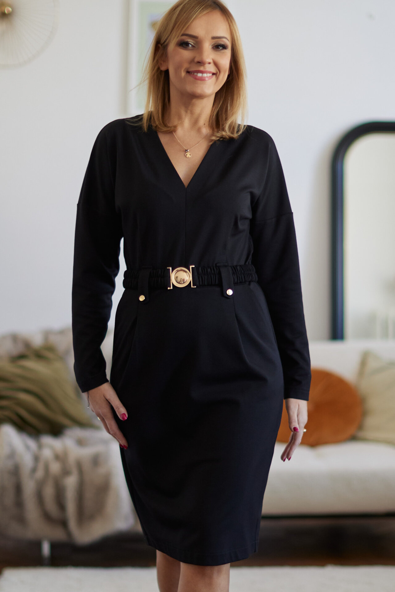 Elegant black dress with gold fittings